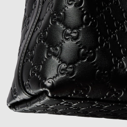 Emblem small bucket bag