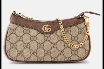 Beige handbag with brown accents on a white background